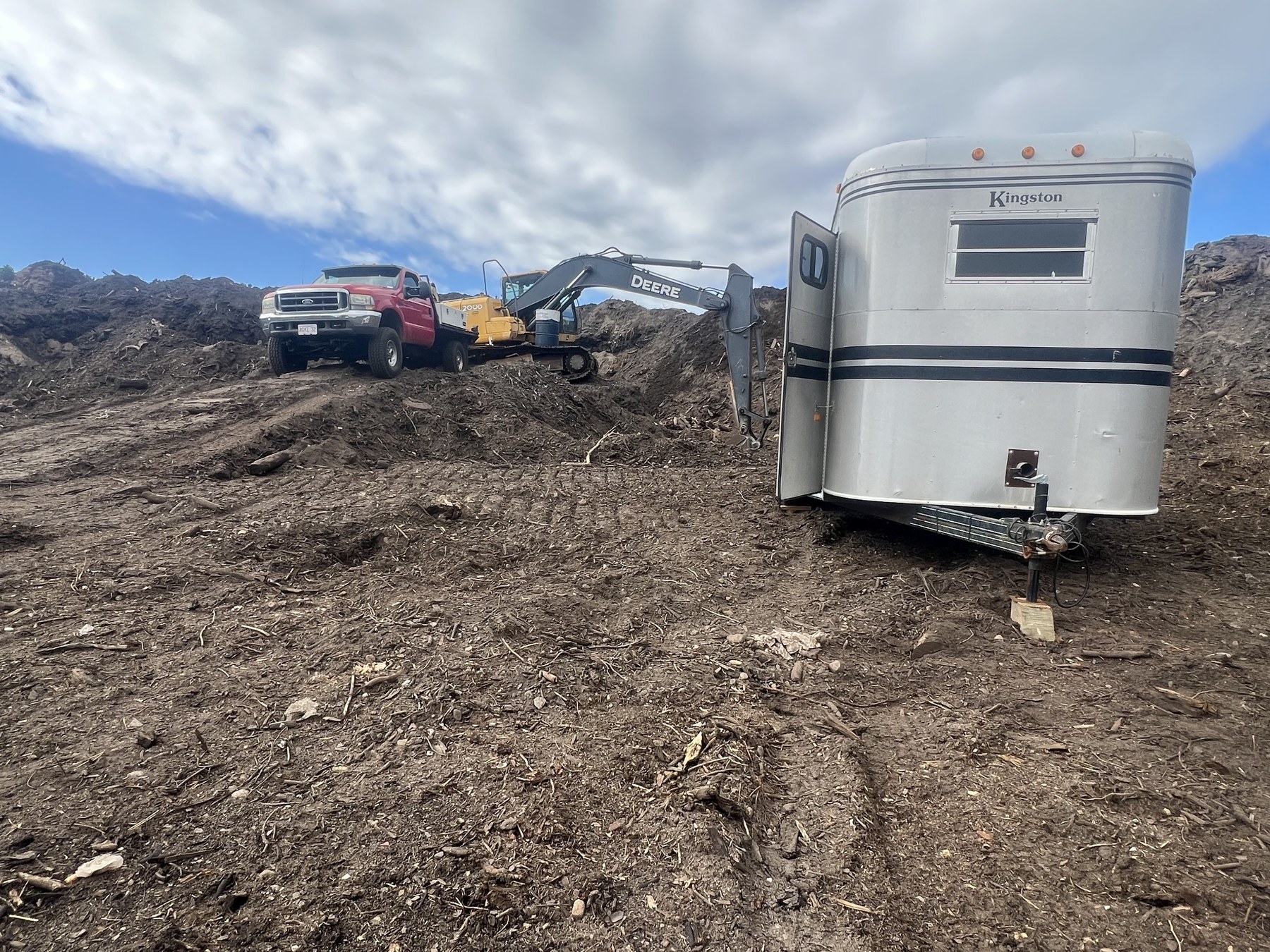 Bober Repair truck and heavy equipment at a job site