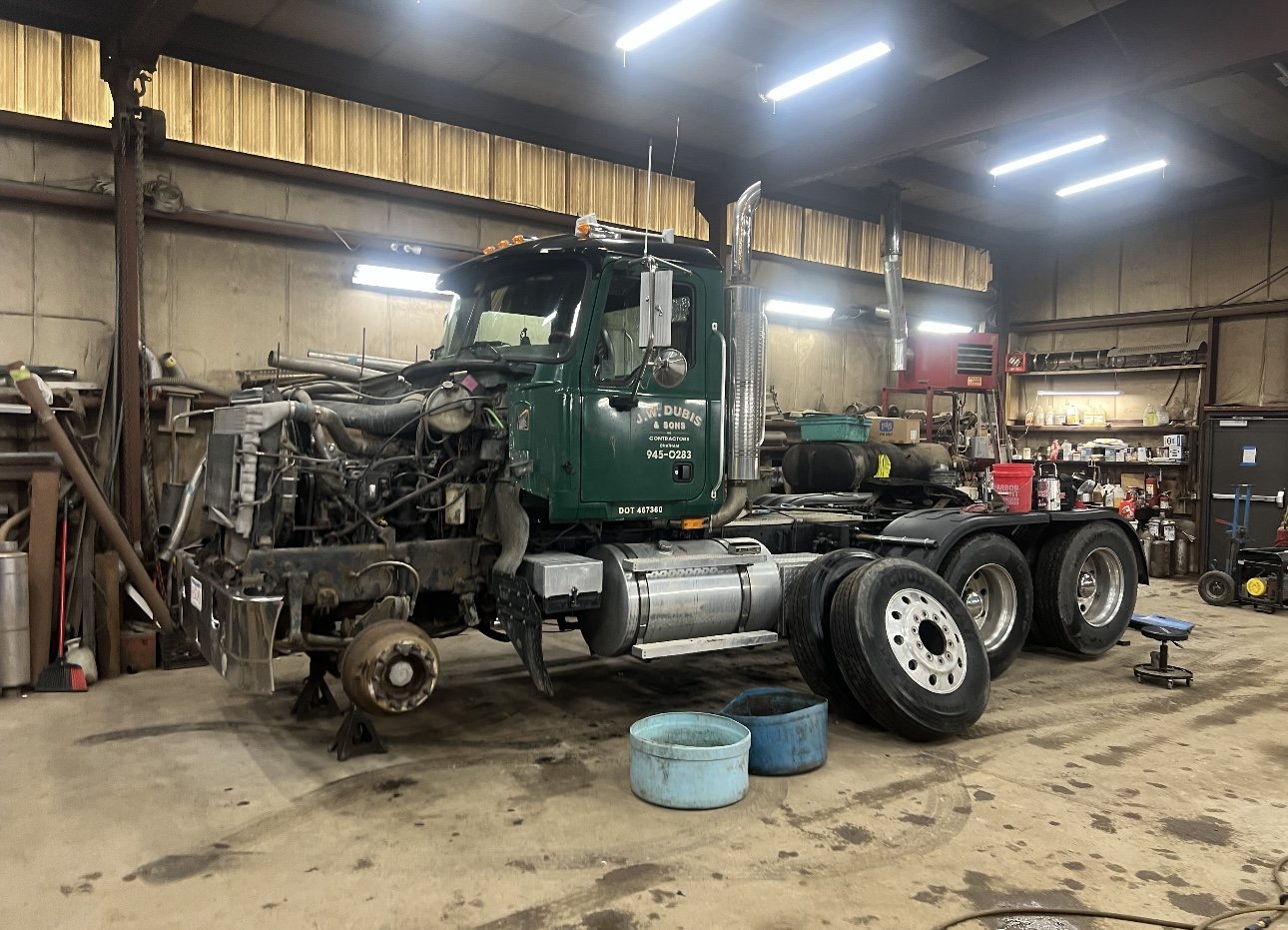 Heavy-duty truck undergoing repair in the shop